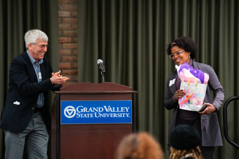 Dr. Terri Givens is presented with a gift
